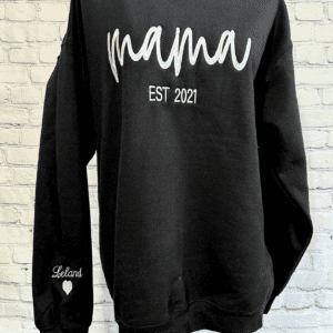 Black sweatshirt with stylish 'Mama' embroidery from Beach Bum Graphics, adding a touch of warmth and charm to your casual wardrobe.